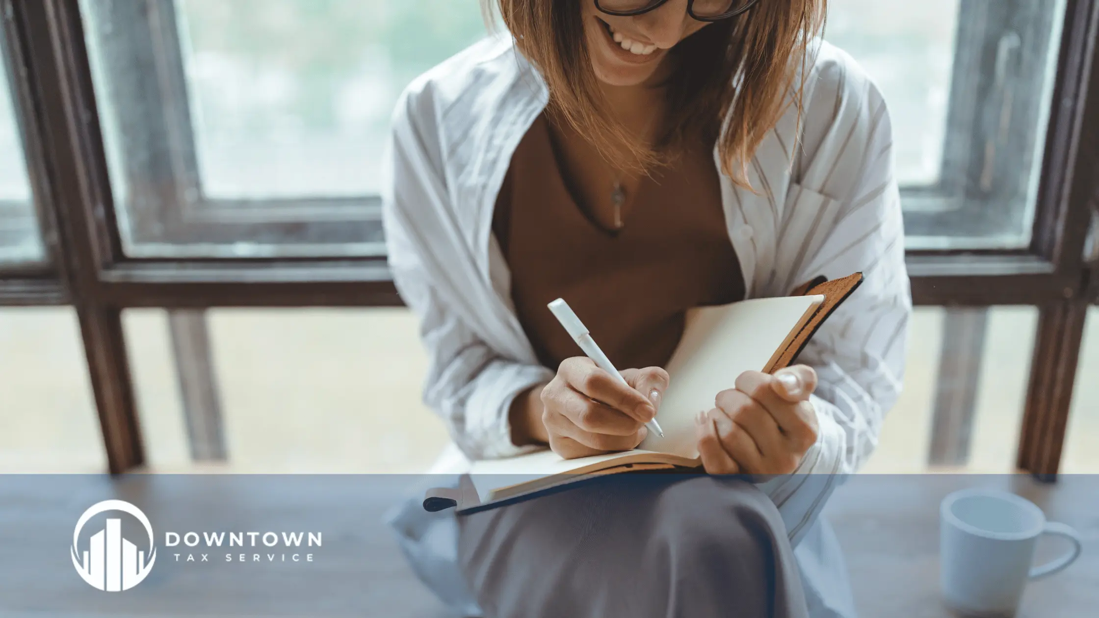 A tax professional reviewing documents with a client during a calm tax appointment