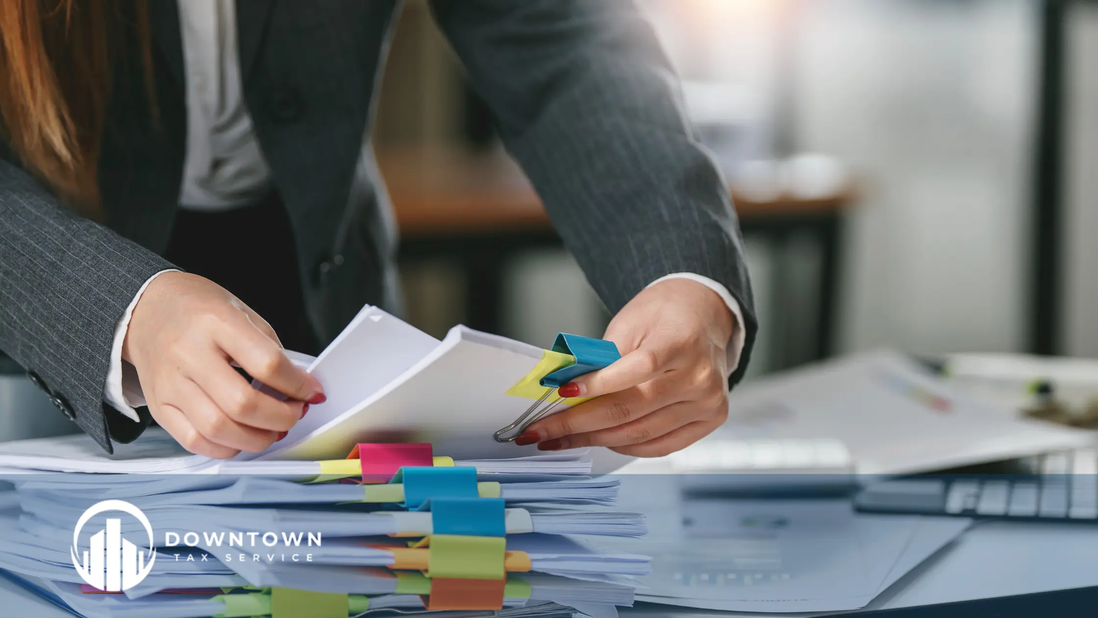 An Enrolled Agent reviewing tax documents with a client